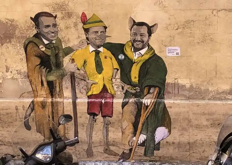 GIUSEPPE CONTE PINOCCHIO IN MEZZO AL GATTO (LUIGI DI MAIO) E LA VOLPE (MATTEO SALVINI) MURALE BY TVBOY