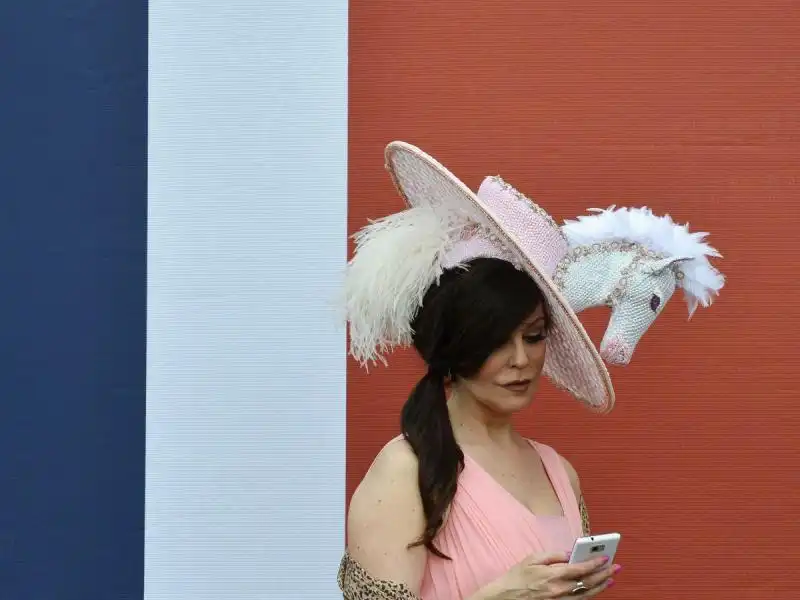 this racegoers hat seemed very appropriate for an equestrian event 