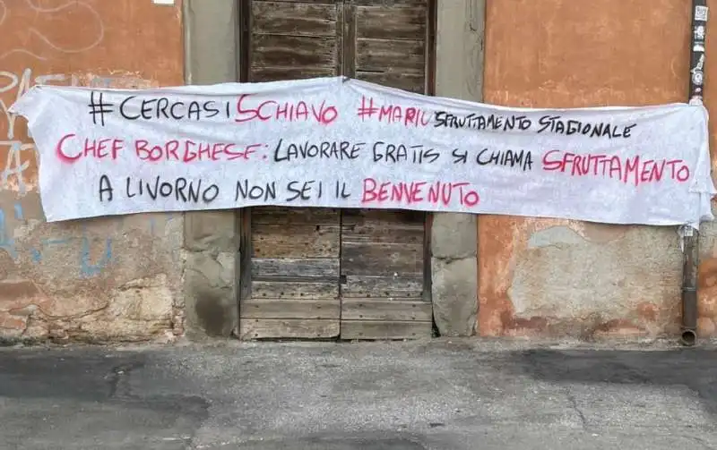 lo striscione a livorno contro alessandro borghese