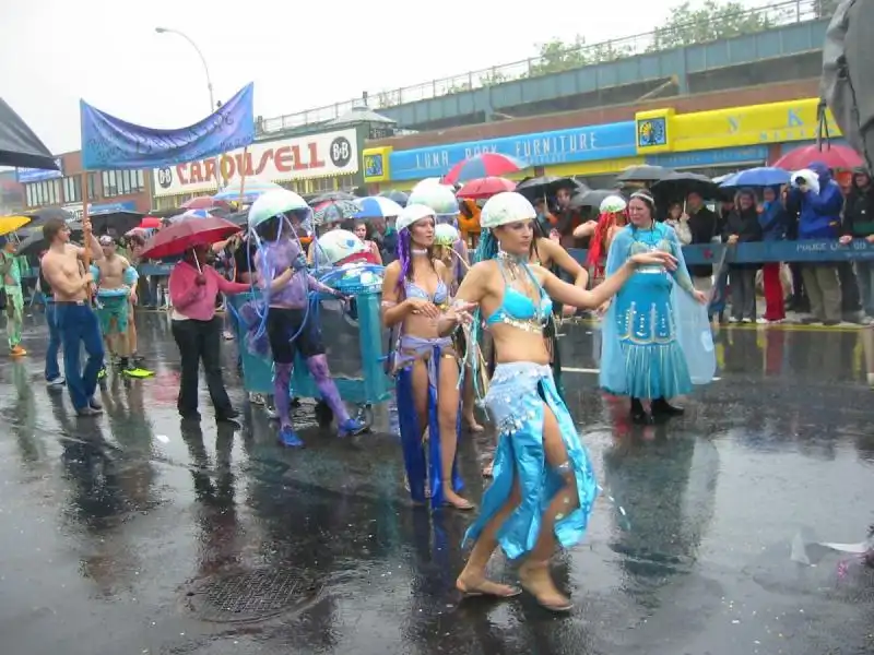 MERMAID HISTORY the mermaid parade was a wet one but that didnt stop these amphibious parade goers from strutting their stuff 