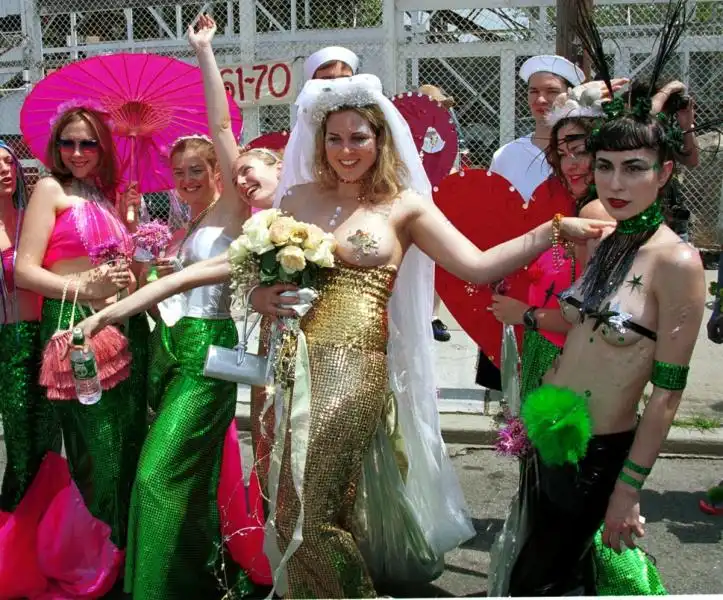 MERMAID HISTORY a glittering mermaid bride makes her way down the coney island boardwalk at the parade 