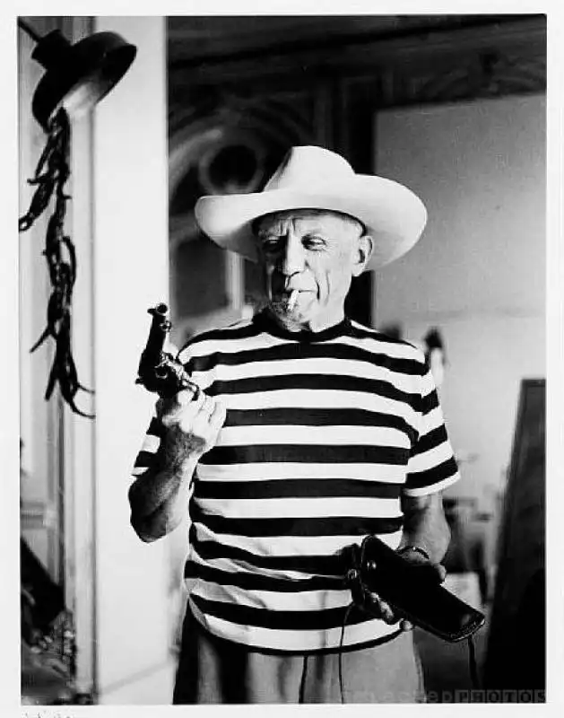 rene burri picasso with revolver and hat of gary cooper cannes 1958