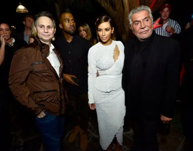 jason binn kanye west kim kardashian and designer roberto cavalli attended dujour magazines event to honor artist marc quinn at the delano hotel  