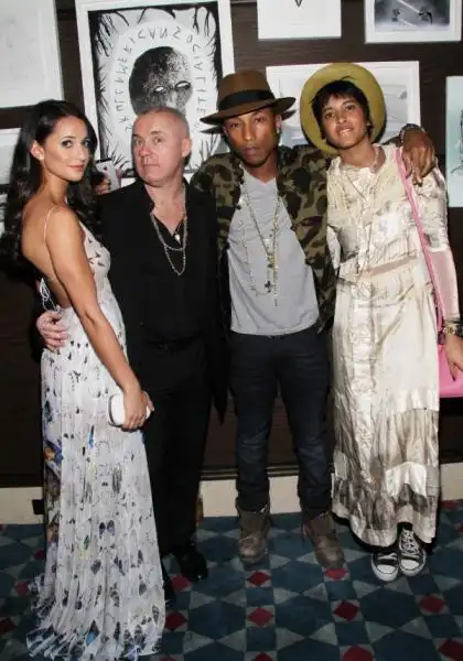 roxie nafousi damien hirst pharrell williams and wife helen lasichanh at the tracey emin dinner hosted by phillips and vanity fair at cecconis at soho beach house  