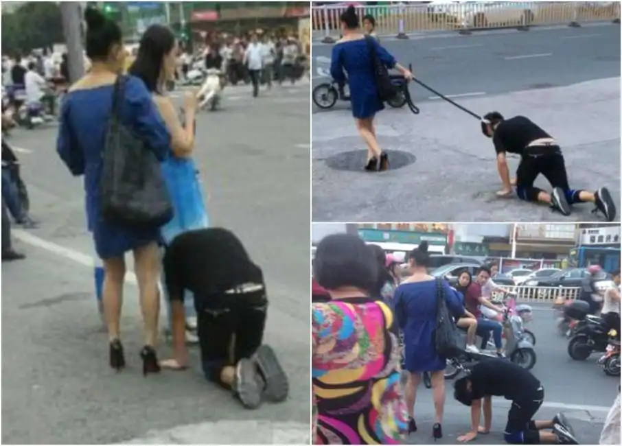 in cina una donna porta un uomo al guinzaglio 